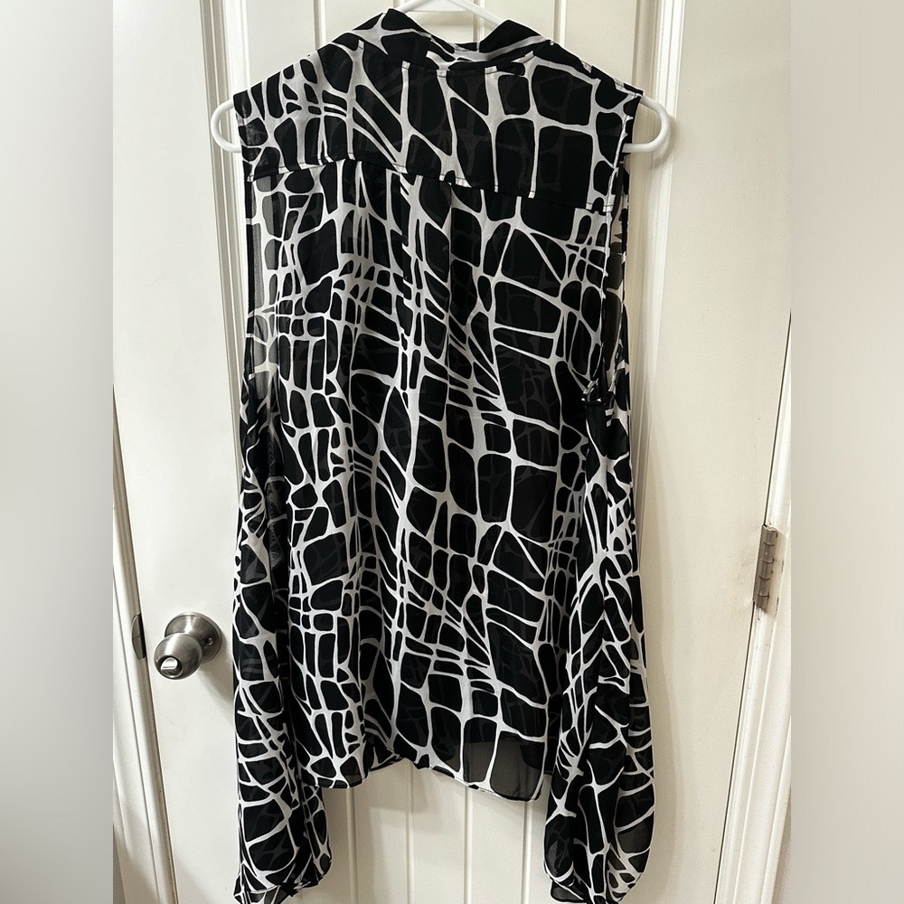 Chico’s black and white vest. Chic animal print with an off-center zipper.